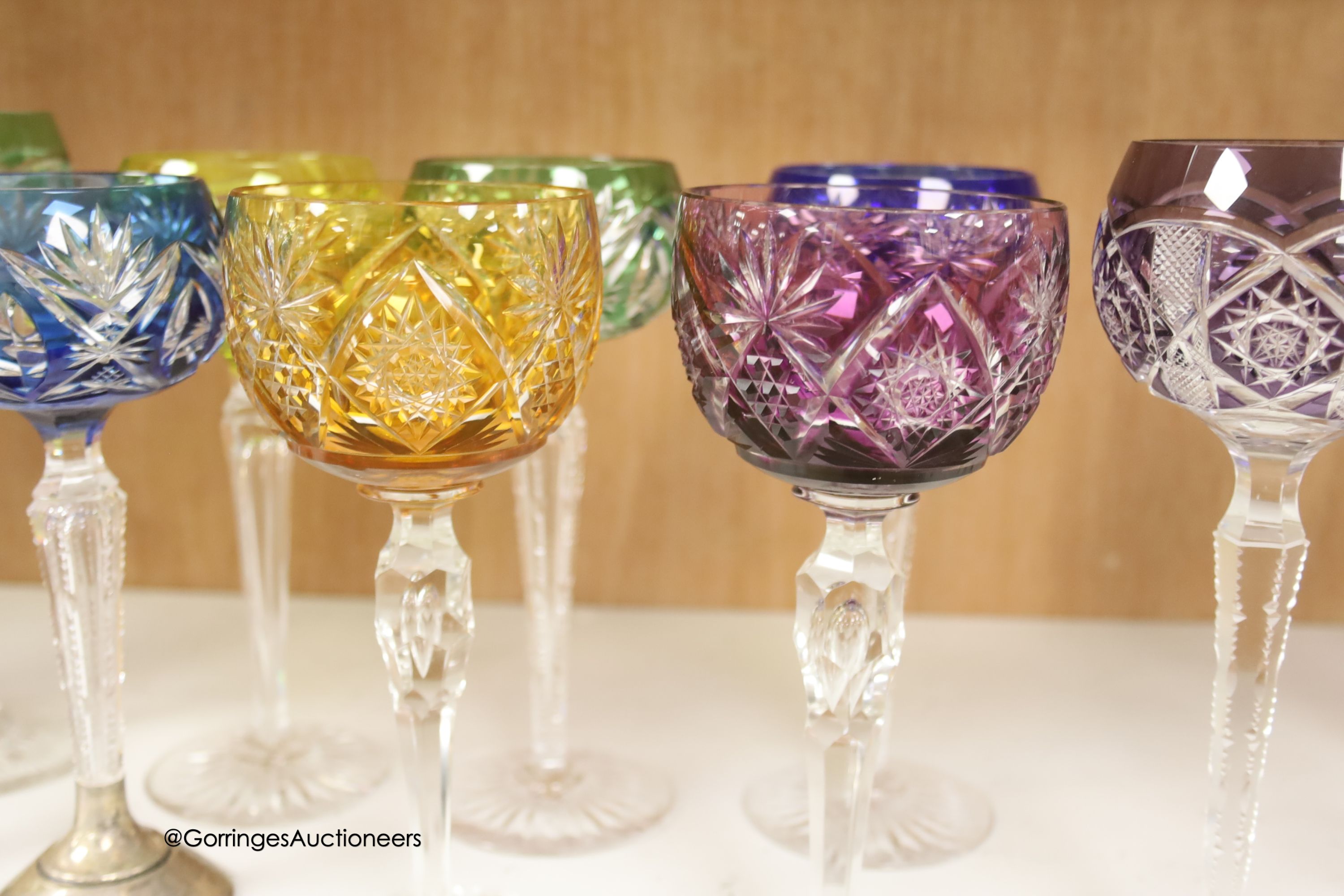 A harlequin collection of flash cut hock glasses, 19th century and later, tallest 21cm